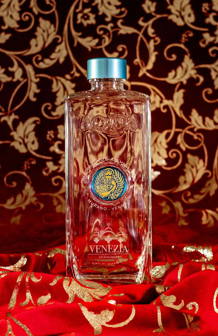 Glass Bottle with Light Blue Murano Glass Medallion with Gold Lion.