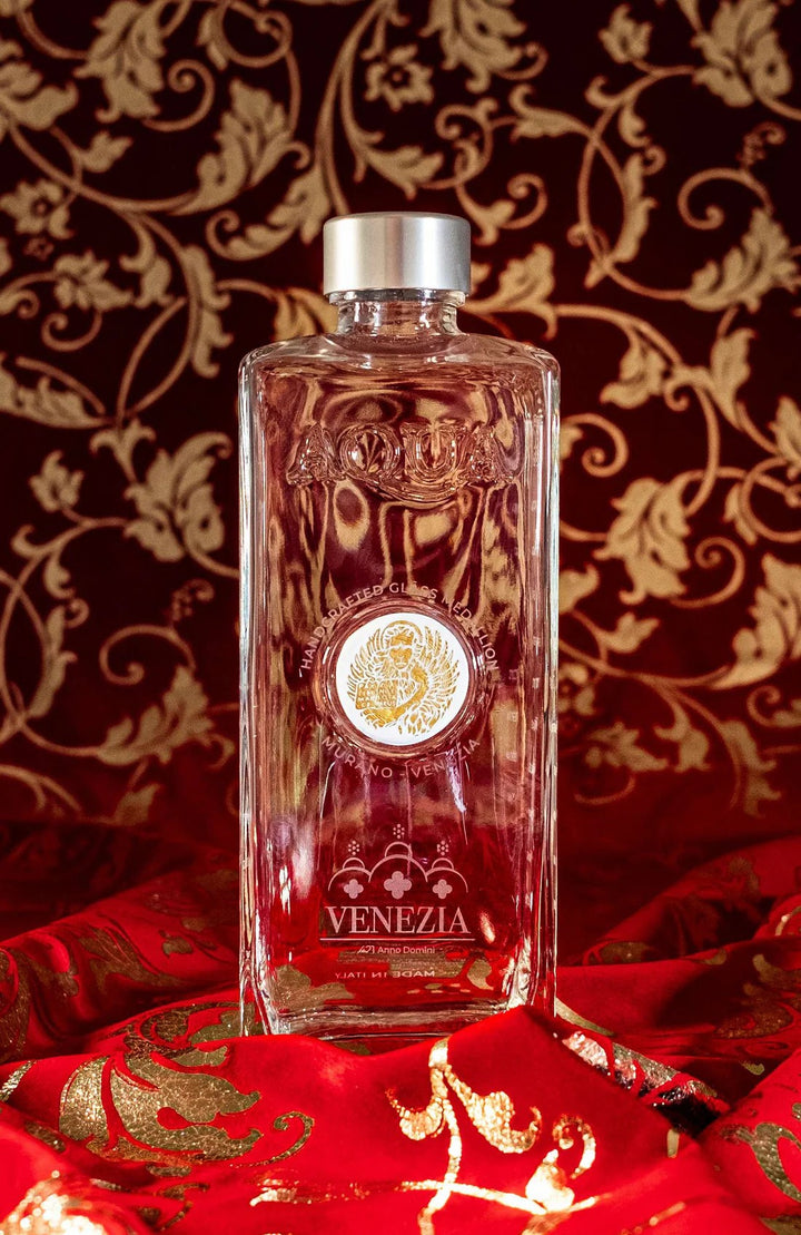 Glass Bottle with White Murano Glass Medallion printed with Gold Lion.