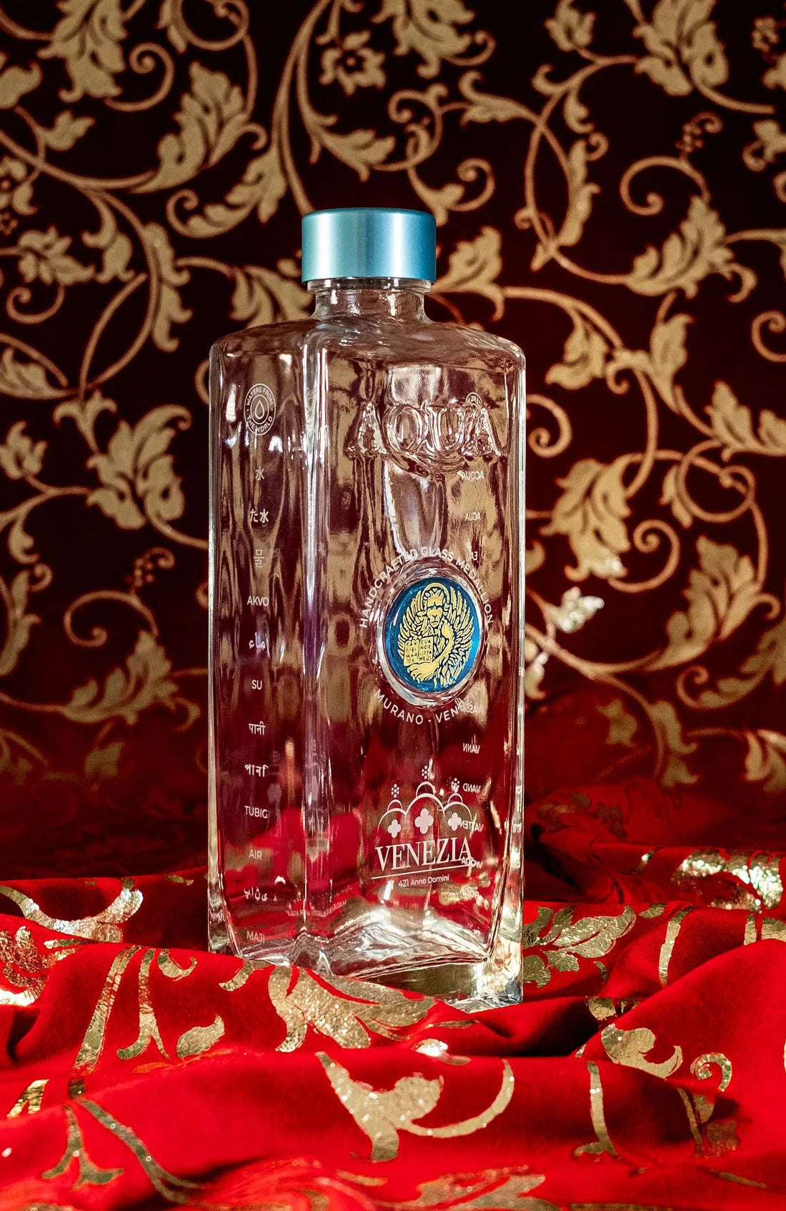Glass Bottle with Light Blue Murano Glass Medallion with Gold Lion.