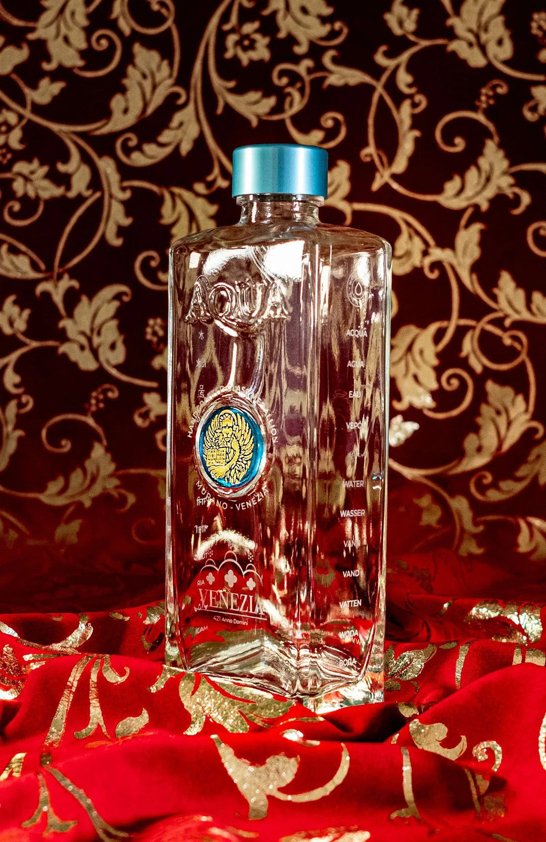 Glass Bottle with Light Blue Murano Glass Medallion with Gold Lion.
